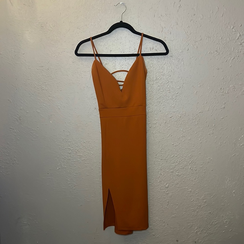 Burnt orange dress with small slit and string tie back